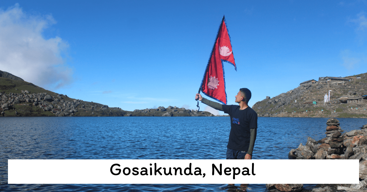 A peaceful mountain lake in Gosaikunda, Nepal, surrounded by dramatic Himalayas.